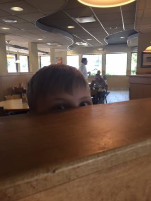 Danny peering over counter